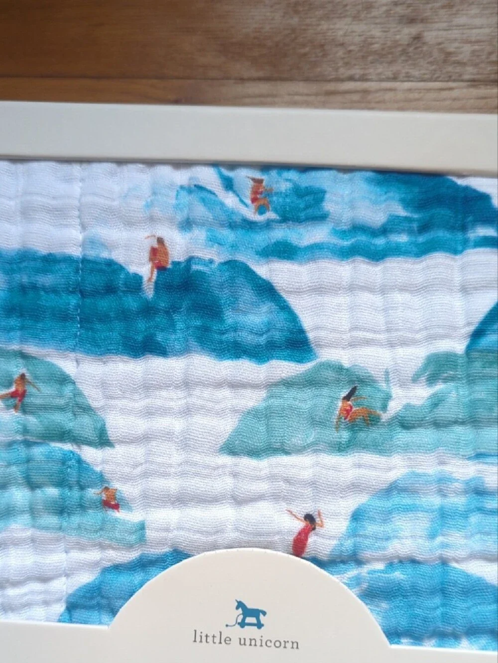 Little Unicorn Cotton Muslin Quilt - Blue & White Waves with Red Swimmers
